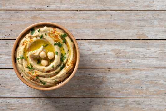 Creamy golden Greek fava split pea purée drizzled with extra virgin olive oil in a rustic bowl