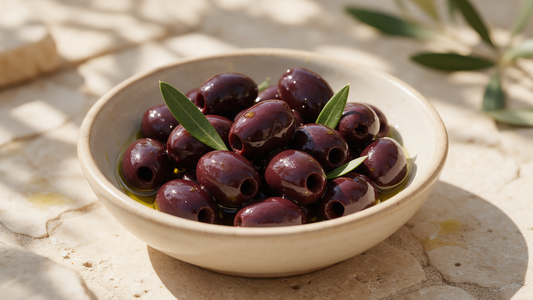 Black Kalamata olives in a rustic bowl drizzled with olive oil